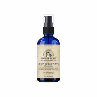 Blue bottle with beige label on a white background