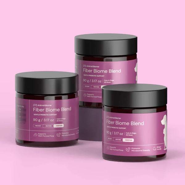Three jars of Fiber Biome Blend on a pink background