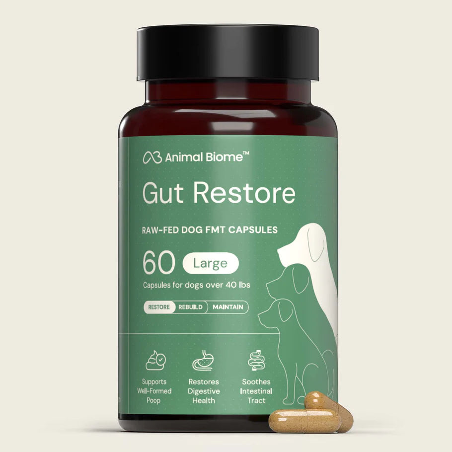 Bottle of Animal Biome Gut Restore raw-fed dog FMT capsules on a beige background