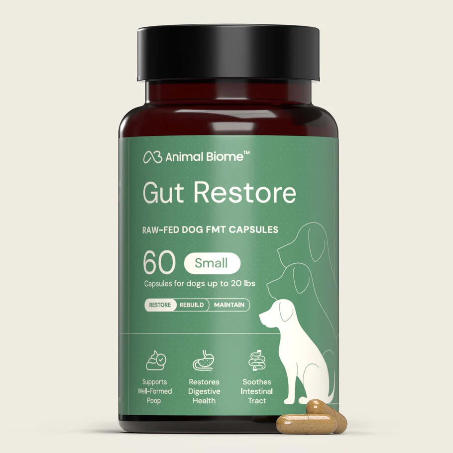Bottle of Animal Biome Gut Restore Raw-Fed Dog FMT Capsules on a beige background