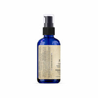 Blue spray bottle with a label on a white background