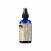 Blue spray bottle with a label on a white background