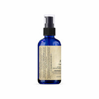 Blue spray bottle with a label on a white background