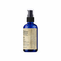 Blue spray bottle with a label on a white background