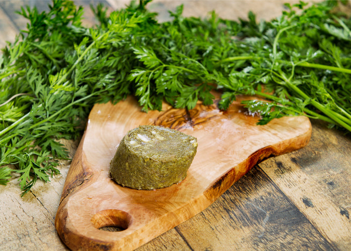 Raw dog food green tripe on a cutting board